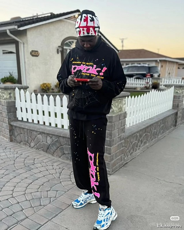 Streetwear Sweatpants with bright pink graphics and a relaxed cuffed fit - Sp5der Layering Edit